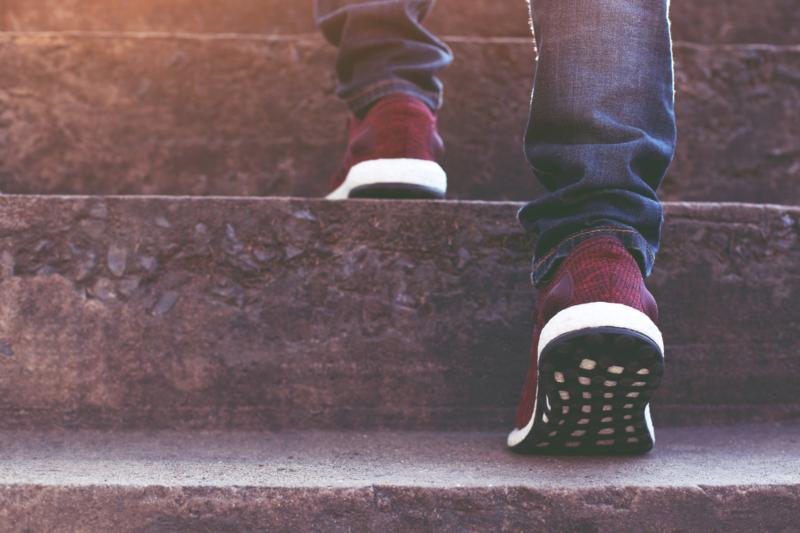 Stairway.,Close,Up,Legs,Jeans,And,Shoes,Sneakers,Red,Of